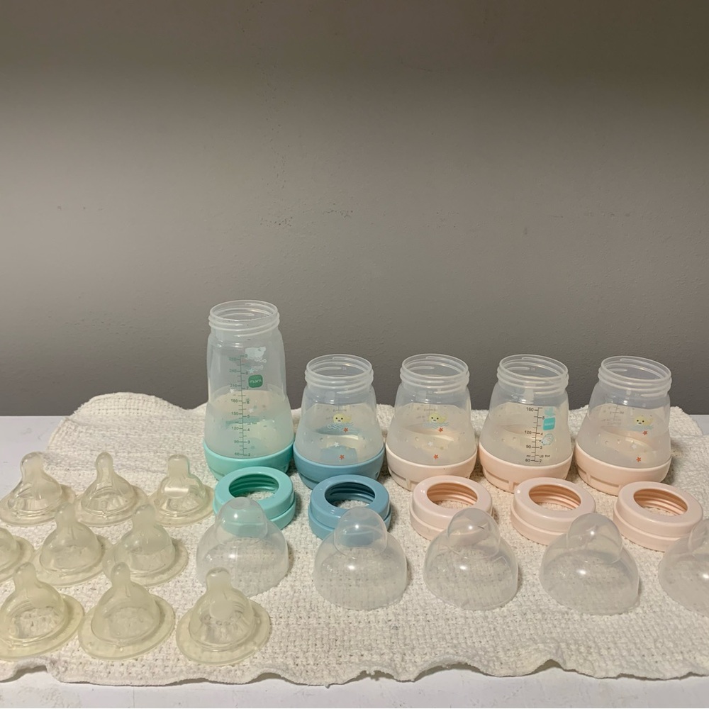 Green and Cream Mam baby bottle set